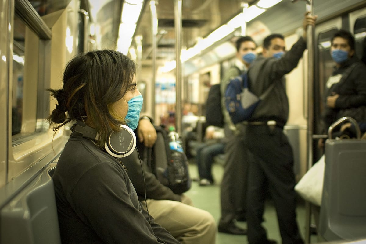 wearing flu masks on the train