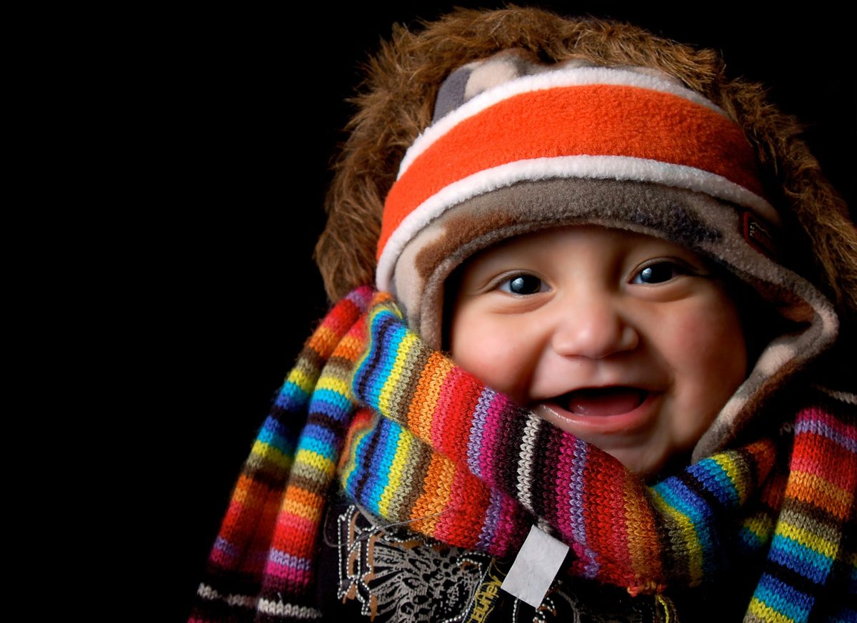 Baby wrapped up in multiple layers.